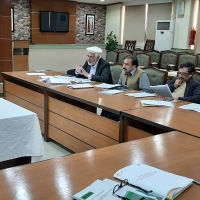 Mr.Shahid Khattak Consultant LGPMS is presenting the draft manual to the LGS review committee members